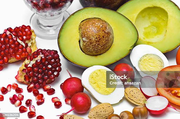 Pome Granate Avocado Egg Radish Nut Tomatoes Stock Photo - Download Image Now - Avocado, Cross Section, Crucifers