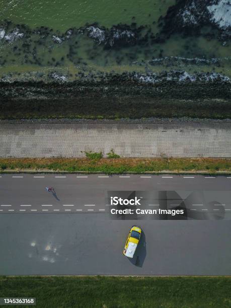 Campervan Parked By The Sea In The Netherlands From Above Drone Shot Stock Photo - Download Image Now