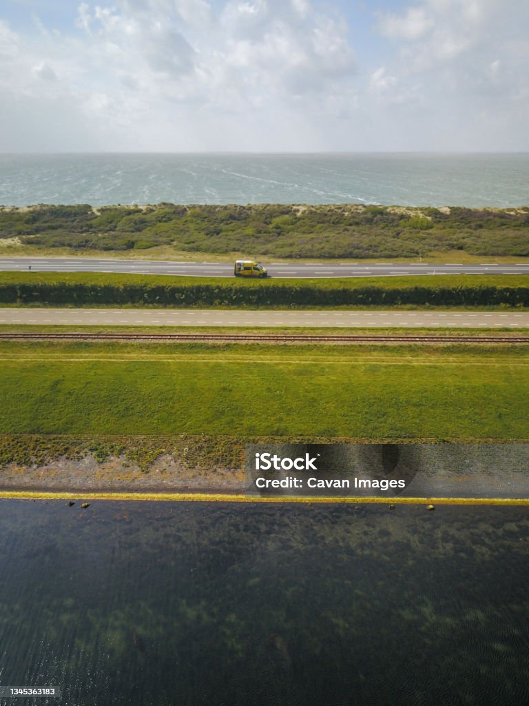 Campervan Parked By the Sea in the Netherlands from above, drone shot Campervan Parked By the Sea in the Netherlands from above, drone shot in The Hague, South Holland, Netherlands Landscape - Scenery Stock Photo