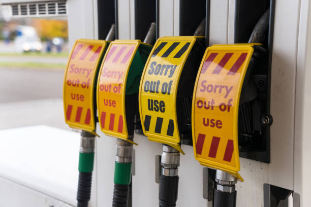 Out of use signs on petrol station pumps A group of petrol and diesel pumps out of use at a gas station, due to a fuel shortage. energy crisis photos stock pictures, royalty-free photos & images