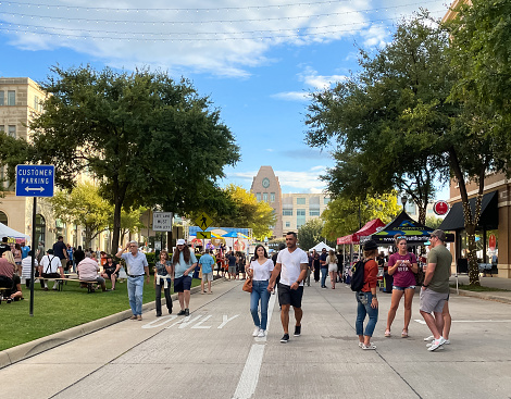 Frisco, TX USA - October 2, 2021: Roadside view of variety people participated Frisco Oktoberfest in Frisco Square