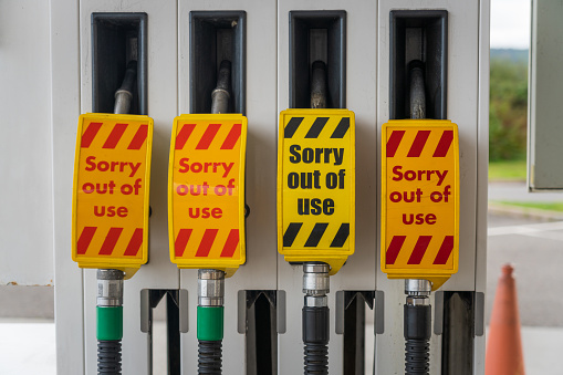 'Sorry Out Of Use' signs on four fuel pumps for unleaded petrol and diesel fuel, during a fuel shortage.