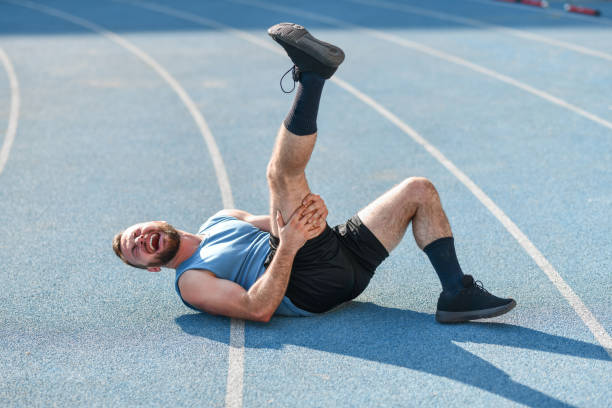 istock Painful Workout For Bearded Male Athlete On Running Track 1345366487