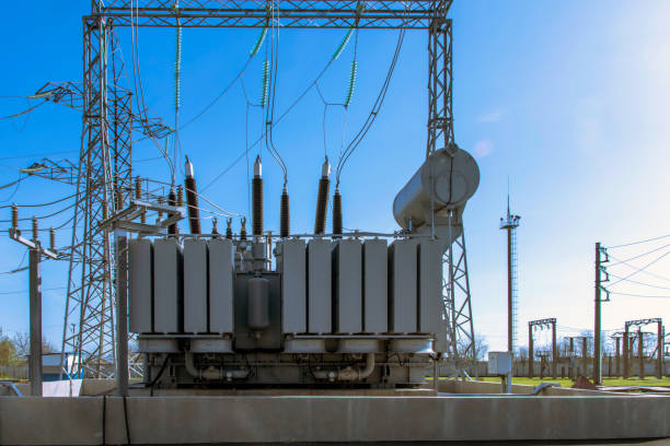 istock Powerful power transformer for industrial high voltage substation. Energy enterprise. 1345367346