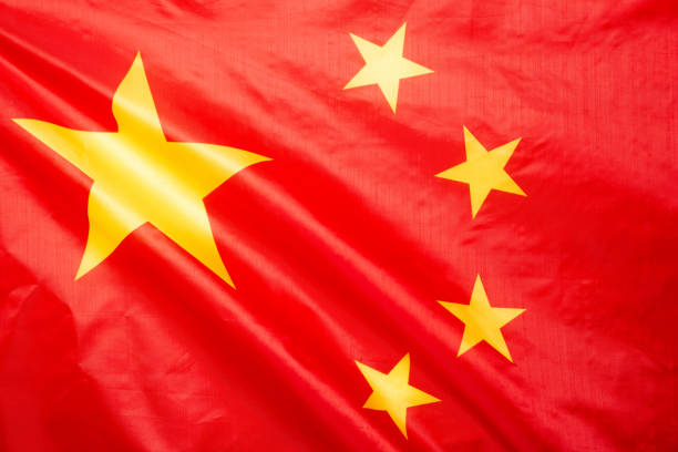 istock China flag waving as a background. 1345368993