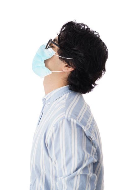 istock Side view of young man with mask and eyes closed 1345370338
