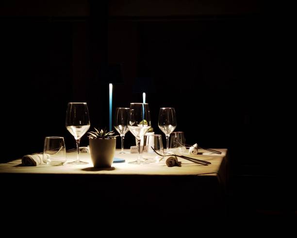 candle-lit restaurant table for a romantic dinner candle-lit restaurant table for a romantic dinner on the Ligurian Riviera candle light dinner stock pictures, royalty-free photos & images