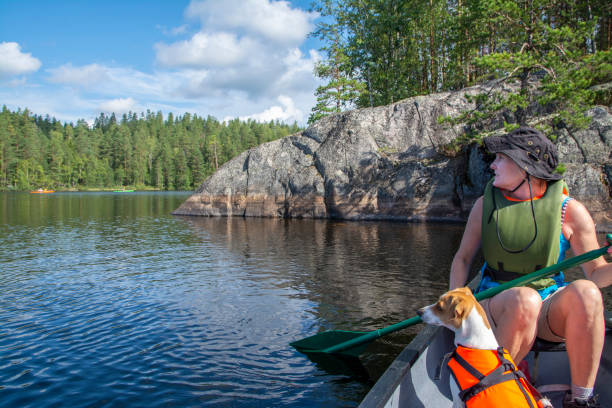 istock Woman canoeing with dog 1345373102