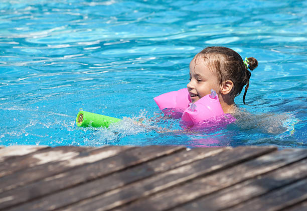 istock Joyful little girl swimming 134537333