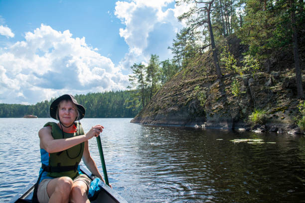 istock Woman canoeing with dog 1345374066
