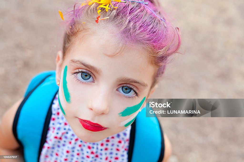 blue eyes  children girl  pinted face makeup blue eyes  children girl  painted face makeup in outdoor party Dyed Hair Stock Photo