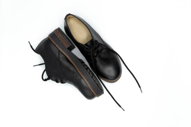 istock Black leather shoes on white background 1345375749