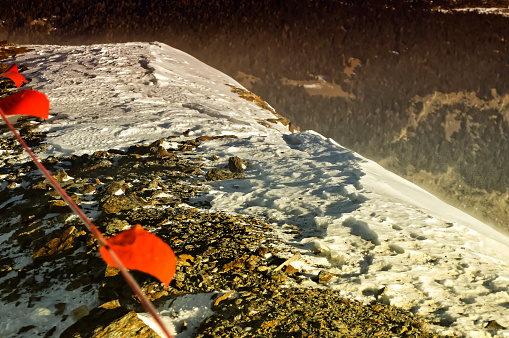 Snow dust and naked rocks during cold winter storm at Bormio, Italy.