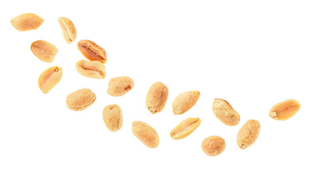 istock Peeled salted peanuts isolated on a white background, top view. Fried peanuts. 1345376939