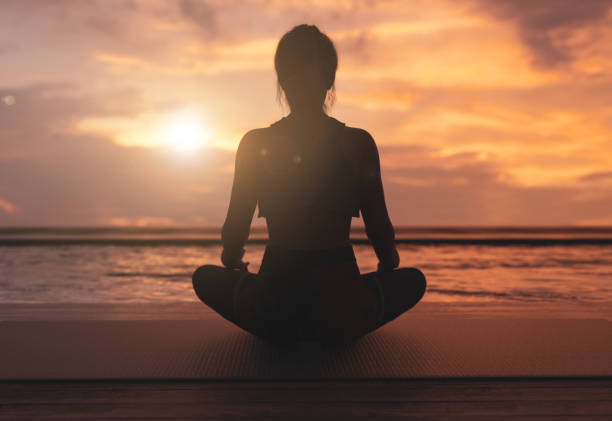 istock Meditaion, relaxing in sunset. - 3d rendering 1345377161