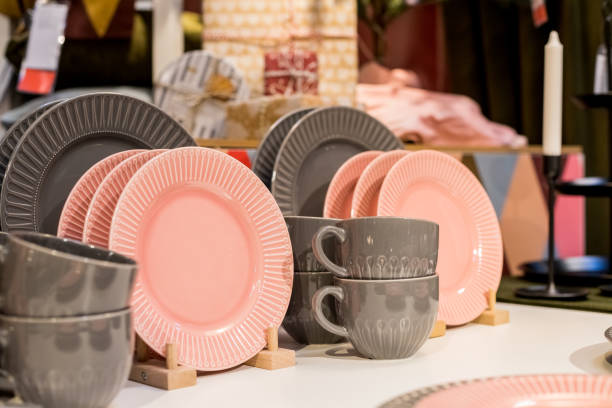istock New gray, pink table setting . modern style. Serving for store catalog. Hot drinks tea or coffee. Stylish elegant ceramic dishware on shop shelves,Various kitchen utensils.Tender, pastel color 1345378631