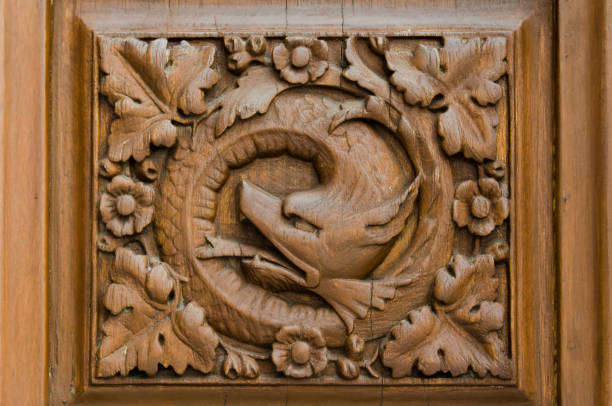 Mexico city / Mexico; May 21, 2014: wood carving representing Quetzalcoatl, the Mesoamerican feathered serpent, detail of a door of Chapultepec Castle