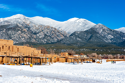 Examples of the  adobe architecture of Taos Pueblo,  in New Mexico, a multistory adobe complex inhabited by Native Americans for centuries. A longtime artist colony, Taos also offers many galleries and museums showcasing regional artwork, including the Harwood Museum of Art and the Taos Art Museum.  This is a popular tourist destination for travelers to the Sant Fe area.