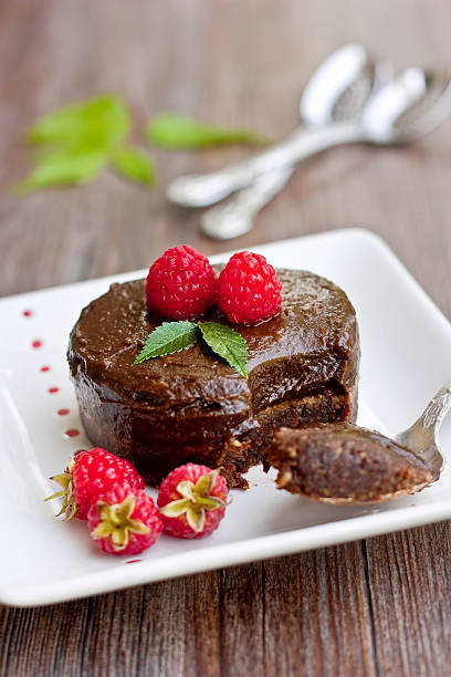istock Chocolate cake dessert with berries and spoon on plate 134538056