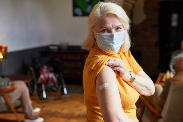 istock Senior Woman Vaccinating 1345383755