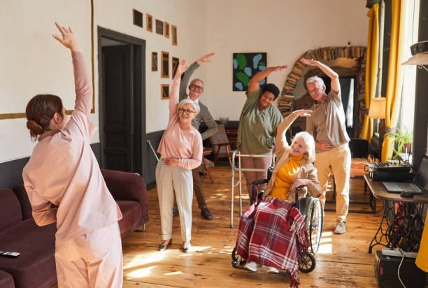 istock Senior People Stretching in Retirement Home 1345383793