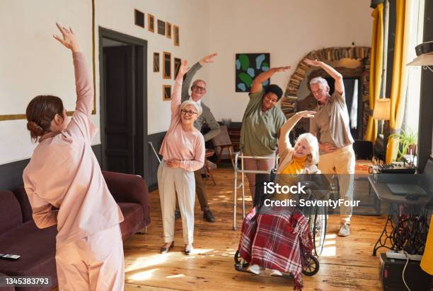 Senior People Stretching in Retirement Home