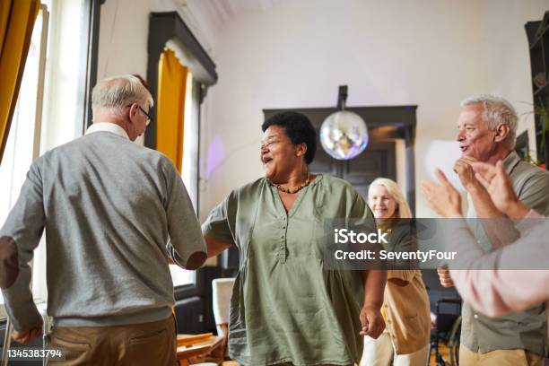 Senior People Dancing In Nursing Home Stock Photo - Download Image Now - Senior Adult, Dancing, Multiracial Group