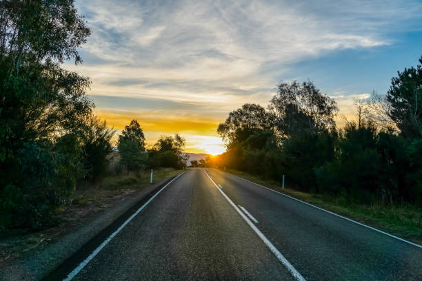 istock A road in the outback of Australia with the setting sun. 1345393549