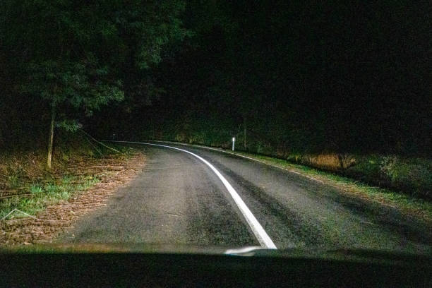 istock Driving on a road in the dark in Australia. 1345393596