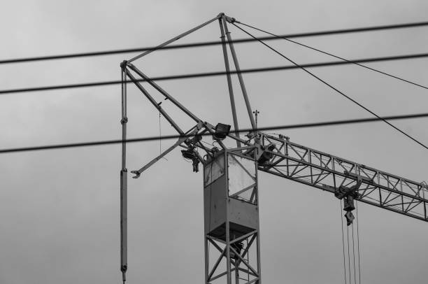 istock high crane construction against the sky with airplane 1345399548