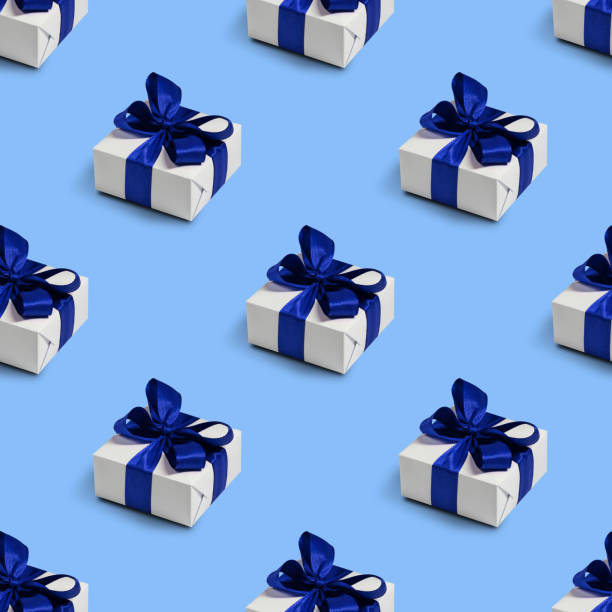istock Seamless pattern with cute gifts on blue background. Christmas decorations. 1345403411