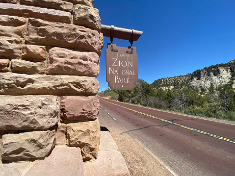 Hanging road sign leaving Zion National Park