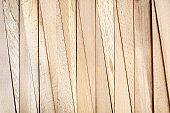 Wooden wedge Chopped used in the construction for balance new door. hardware store. Close up Wooden background