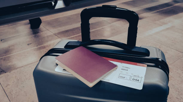 istock Suitcase, passport and ticket at the airport 1345407405