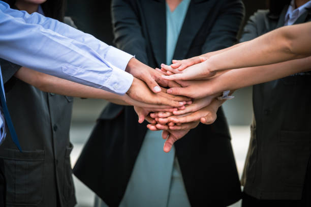 istock business people team stacking hands and teamwork concept. 1345407586