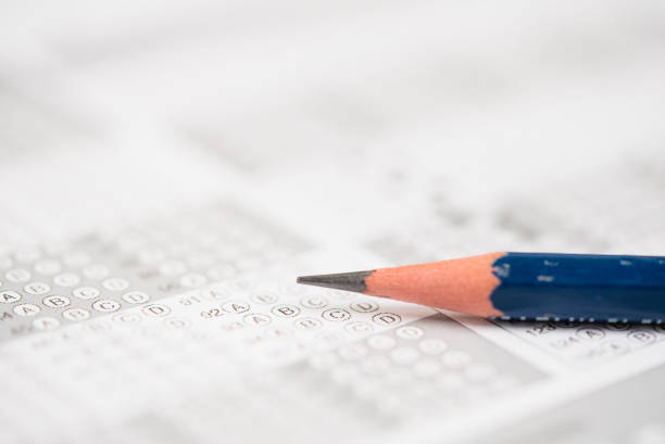 istock close up Pencil on the answer sheet for Test Score Sheet With Answers 1345407647