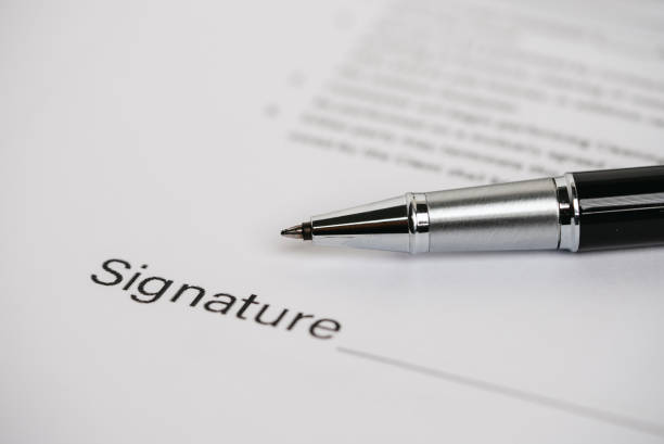istock Pens and contract documents are placed on the desk. 1345407650