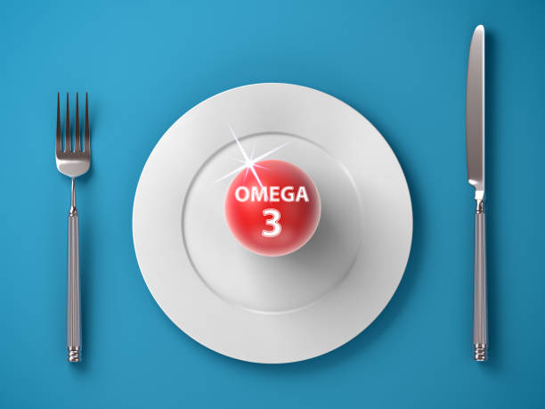 omega-3 su un piatto isolato su sfondo blu è preparato per essere mangiato come simbolo di una dieta sana. - 16330 foto e immagini stock