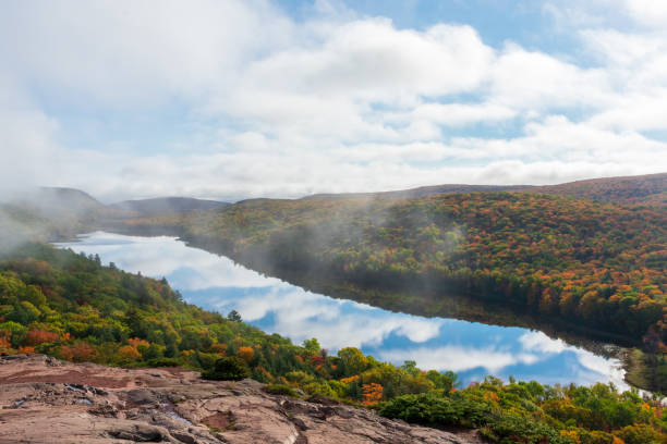 istock Clouds reflecting in mountain lake in autumn 1345411125