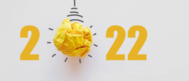 istock 2022 Yellow paper light bulb, innovative business vision and resolution concept 1345411327