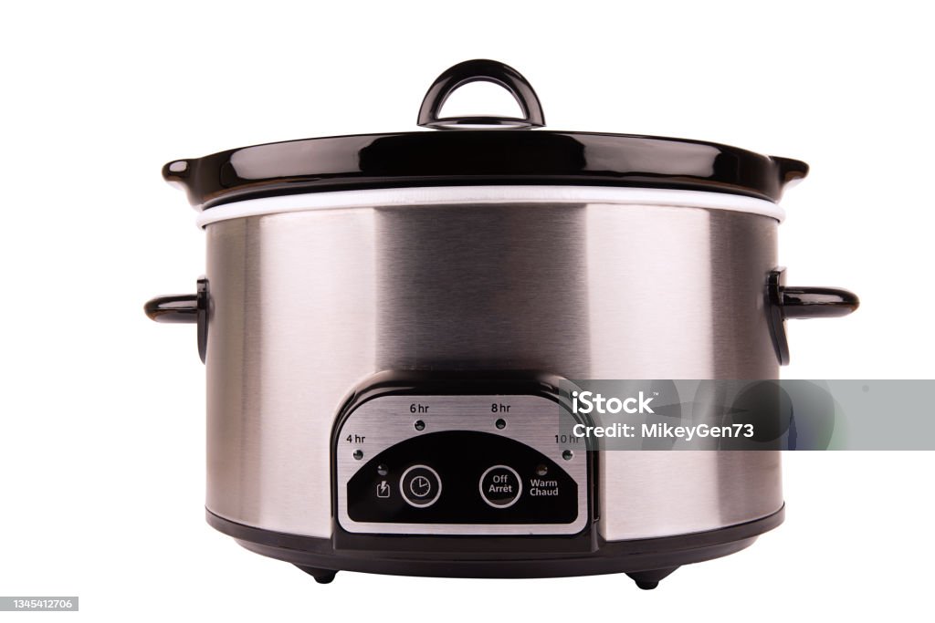 Stainless crock pot isolated on a white background. Stainless crock pot isolated on a white background. Cut out. Crock Pot Stock Photo