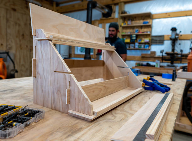 A home made shelf in the foreground with various wood shop tools visible.