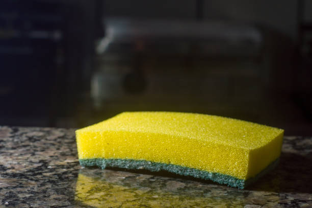 istock yellow spine with dark background and detergent, 1345417863
