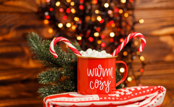 istock Festive Xmas mug with a cookie. Holiday concepts. Festive bokeh. 1345419023