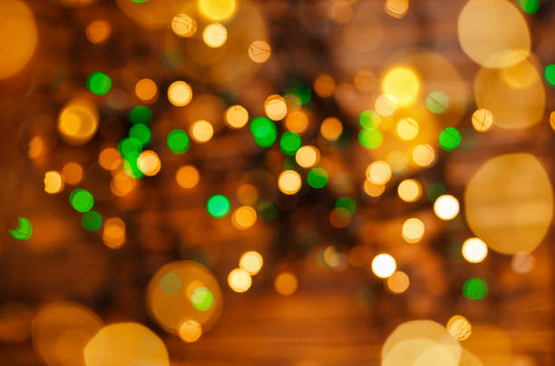 istock Blurred Christmas lights. Twinkle lights bokeh. Defocused gold lights. 1345419606
