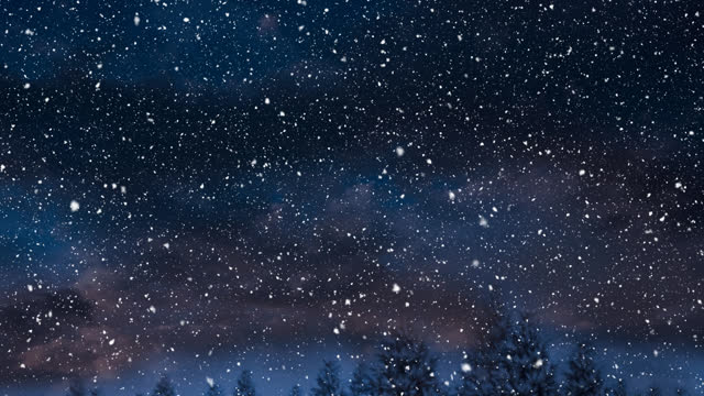 Snow falling over trees on winter landscape against night sky