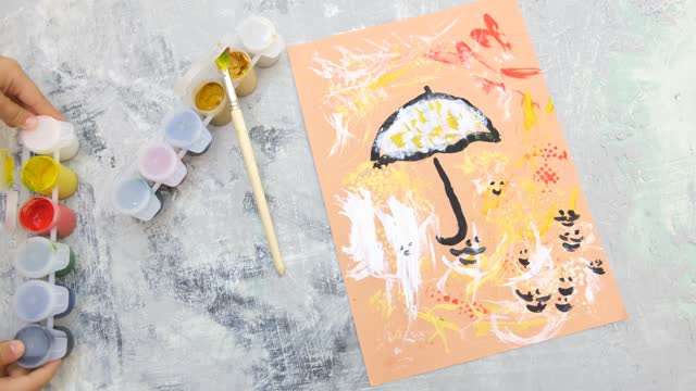 Autumnal card . Child paint umbrella and abstract autumn park use sponge and birds feather like a paintbrush, crafts for kids.