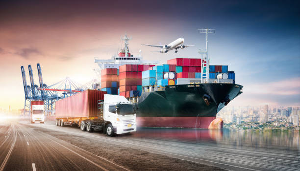 istock Business logistics and transportation concept of containers cargo freight ship and cargo plane in shipyard at sunset sky, logistic import export and transport industry background 1345430414