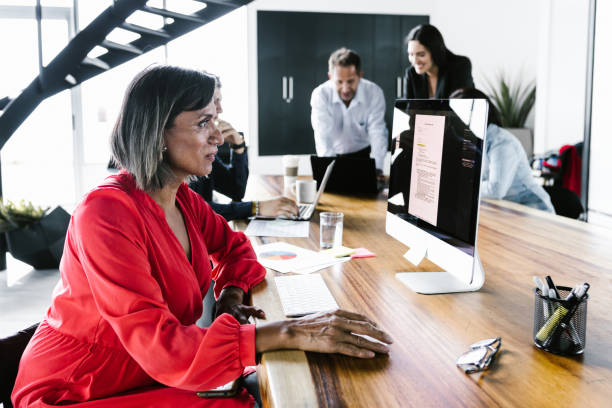 istock Group of latin office employees developing business strategies using digital devices at workplace in Mexico City 1345431514