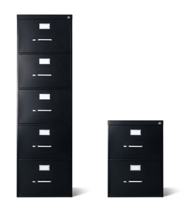 A large balck filing cabinet with five drawers stands next to a two drawer small filing cabinet isolated over 100% white background with cast shadow. Each have a precise clipping path. Canon 5D MarkII DSLR.